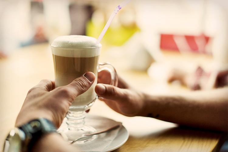 Coffee booster review hands cup