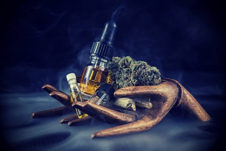 Assorted cannabis oil containers with CBD, nugs, live resin and other thc extractions - medical marijuana concept