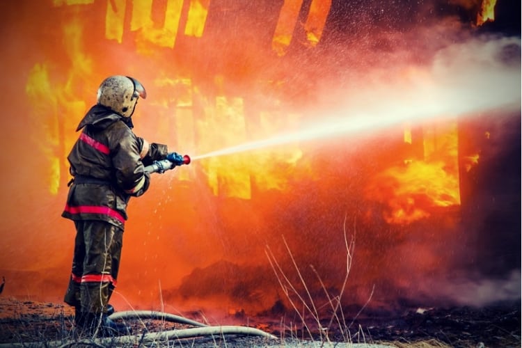 Fireman extinguishes a fire
