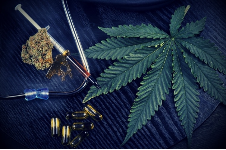 Medical marijuana products with cannabis leaf on black Medical marijuana products with cannabis leaf on black