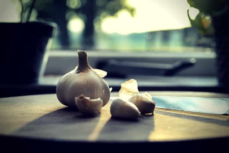 Photography of garlic on wooden table