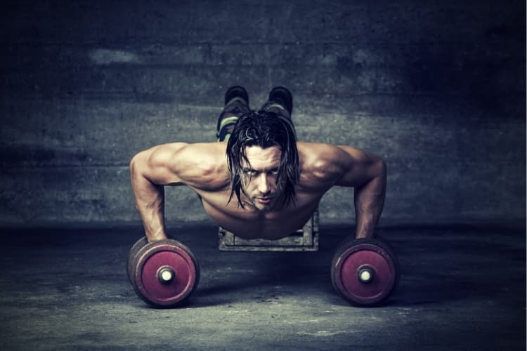 Portrait of handsome man pushing up