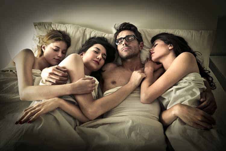 Why Is Sex So Important to Us - man in bed with girls