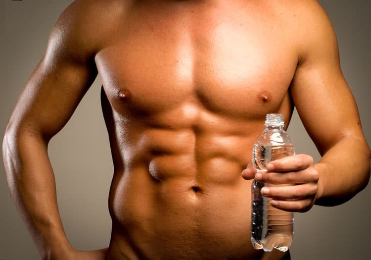 bodybuilder holding a bottled water