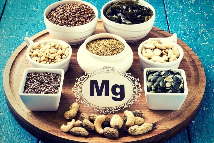 Magnesium-rich foods including dark chocolate, almonds, spinach and pumpkin seeds