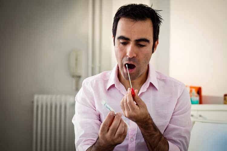 man doing saliva test man doing saliva test